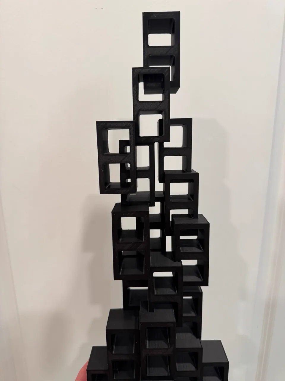 Tall black geometric cube stack sculpture