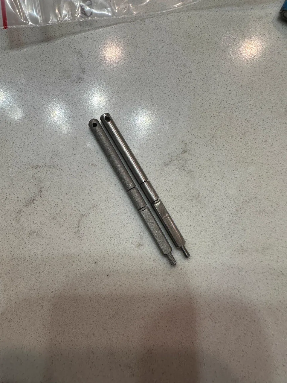 Two SLM metal printed stainless steel threaded push rods