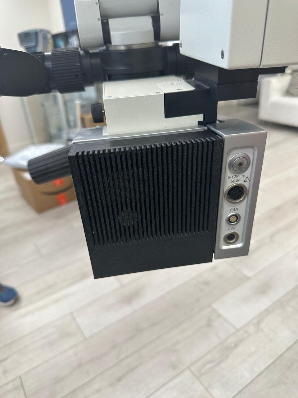 3D printed finned shroud installed on a surgical microscope arm