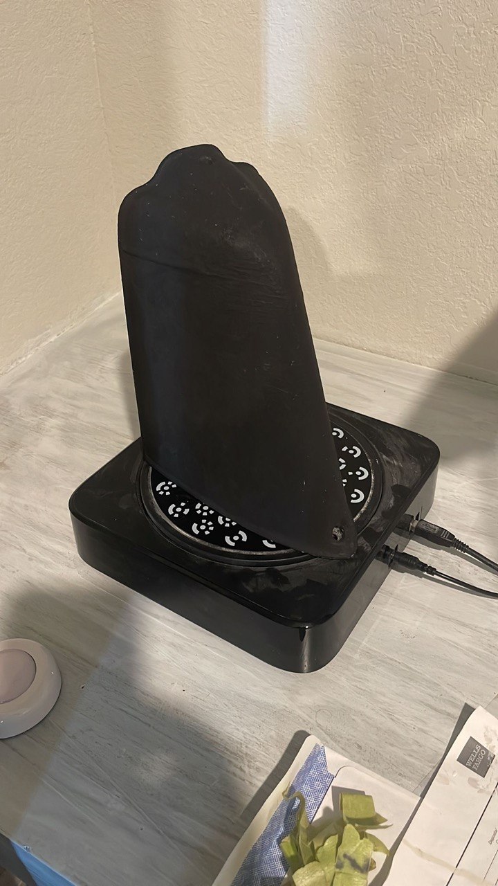 Object mounted on a 3D scanning turntable with calibration markers