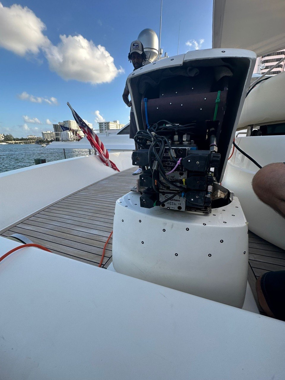 Cracked fiberglass cover over a yacht deck hydraulic manifold
