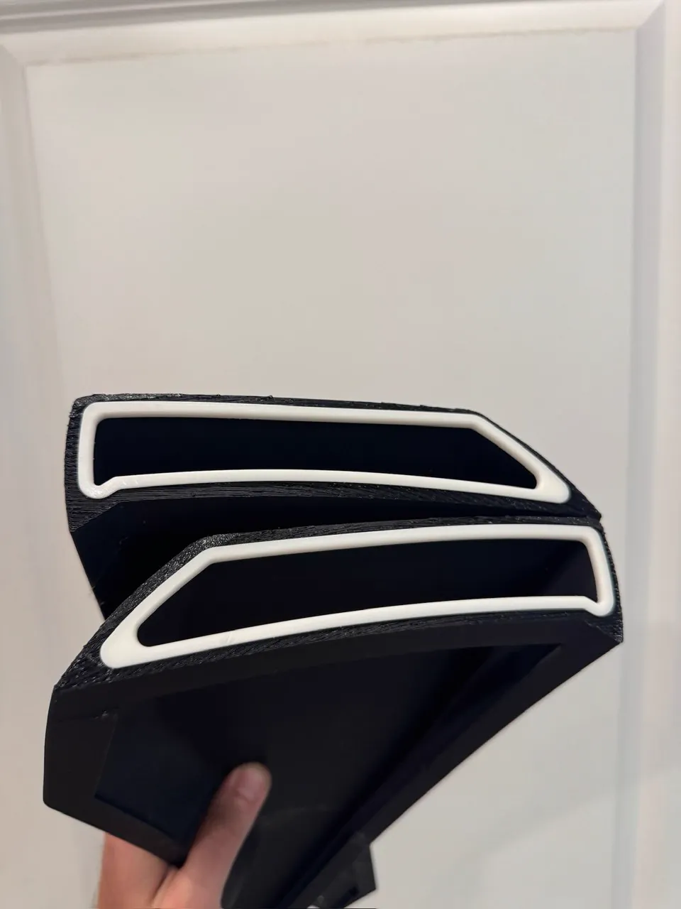 Two-tone black and white 3D printed automotive trim piece